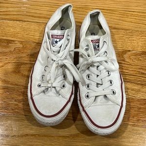 White low-top Converse. Men’s size 5 or women’s size 7.